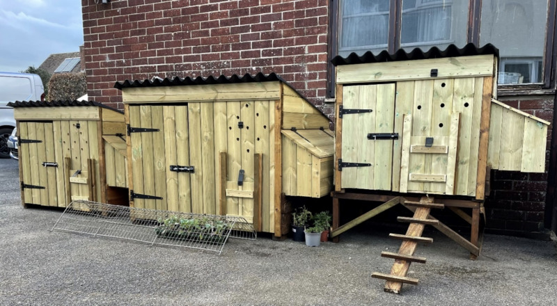 Three of Alan Bright's chicken coops.